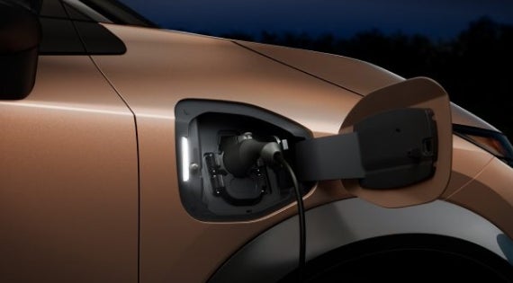 Close-up image of charging cable plugged in | Coastal Nissan in Norwell MA