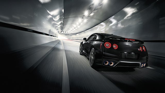 2023 Nissan GT-R seen from behind driving through a tunnel | Coastal Nissan in Norwell MA
